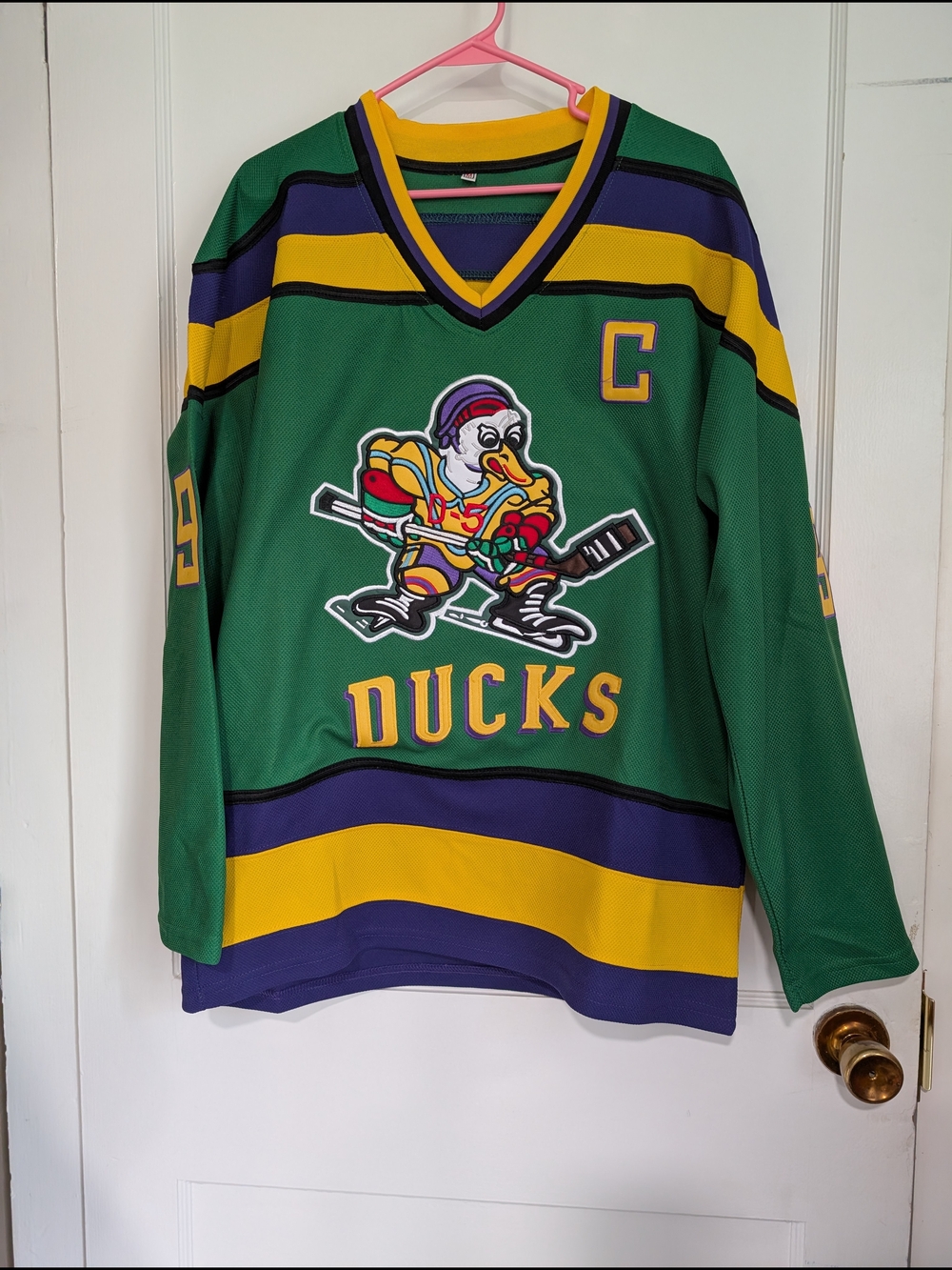 Green Ducks Hockey Jersey with Yellow & Purple Stripes